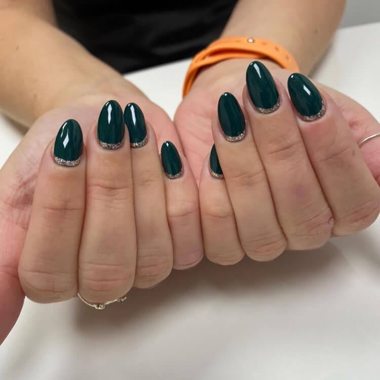 green nails with gold cuffs