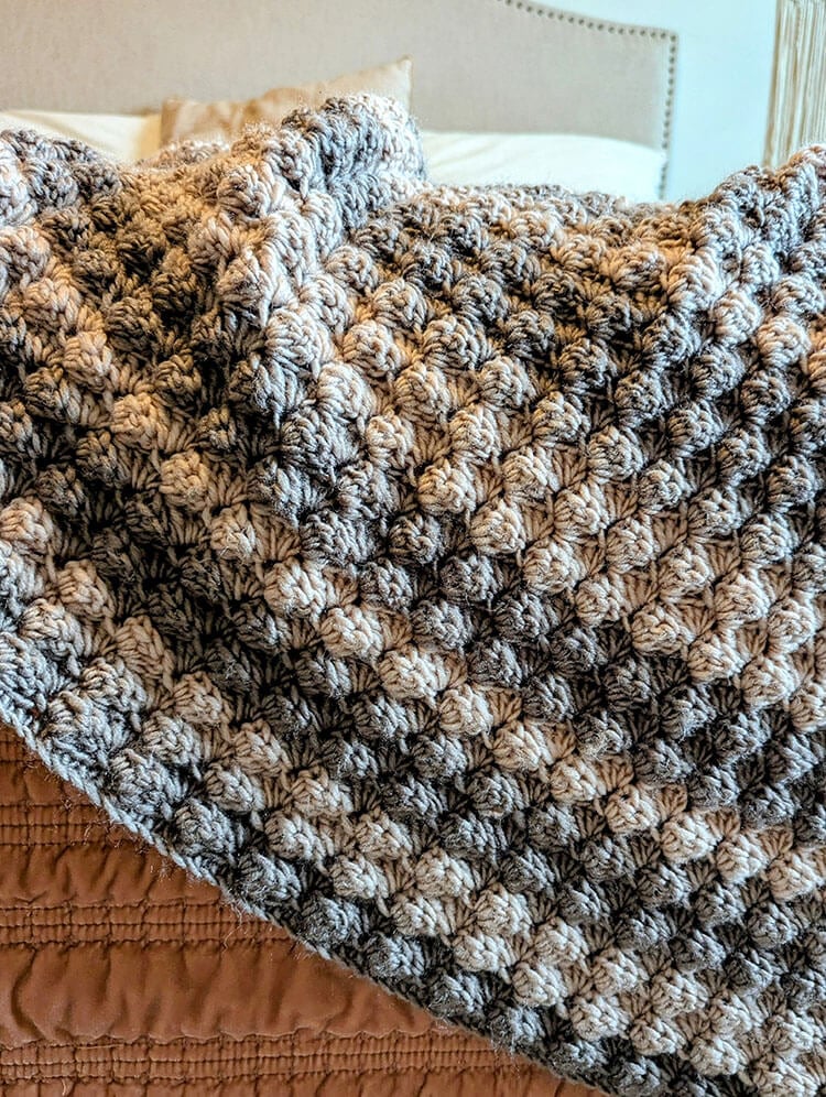 Woodland Blanket Hanging from Bed