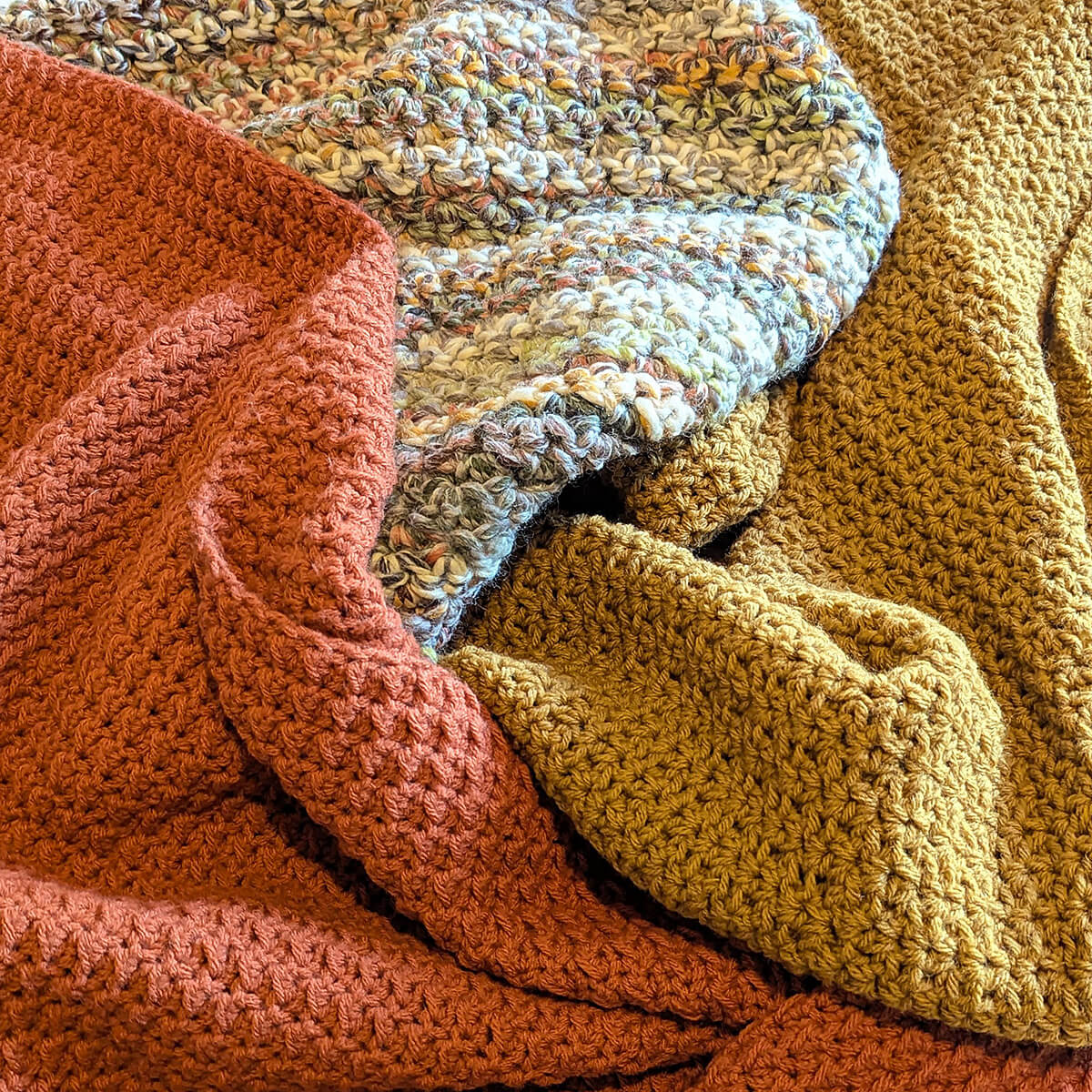 three blankets on a pile